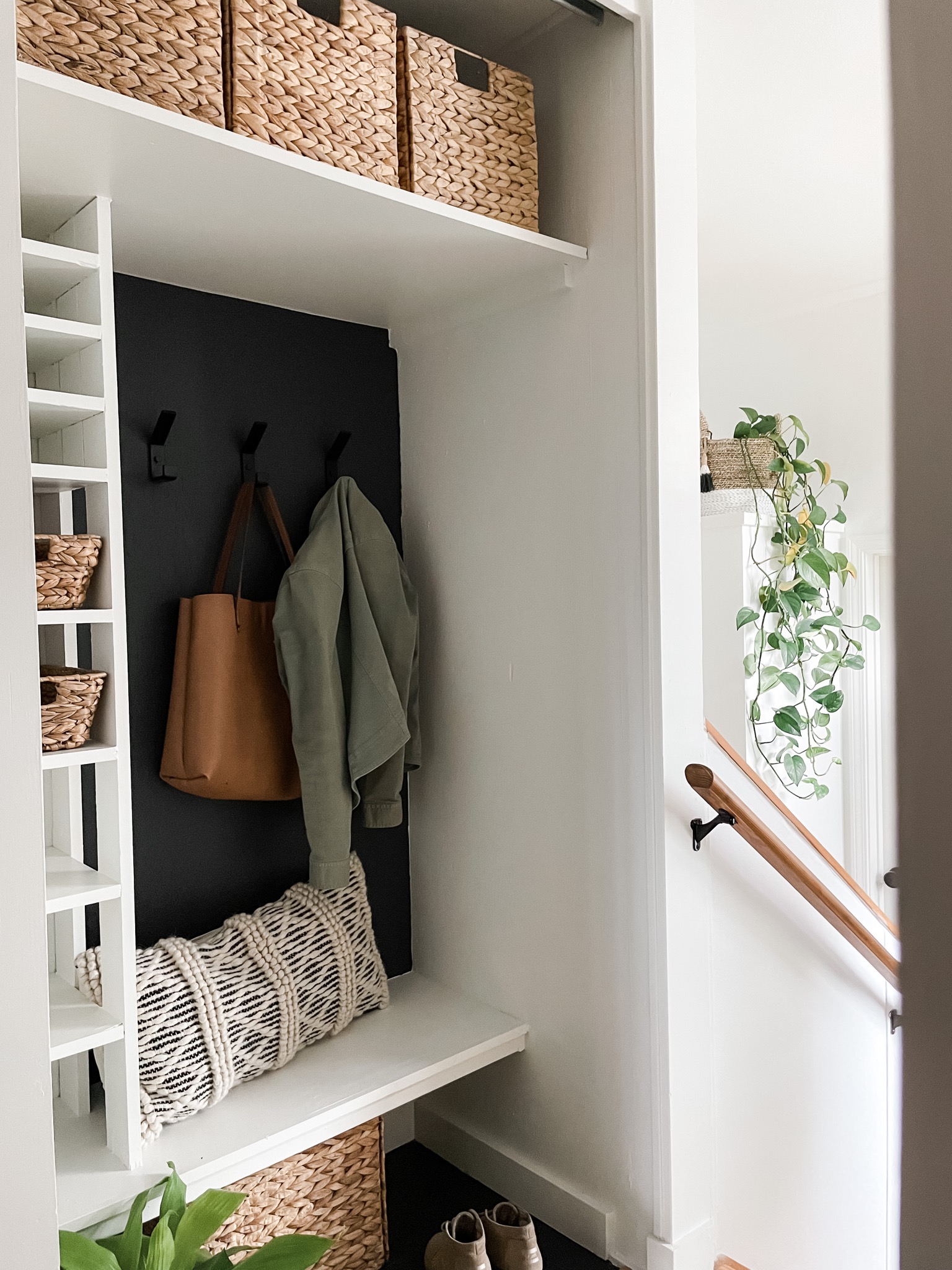 closet with cubby, hooks, and baskets