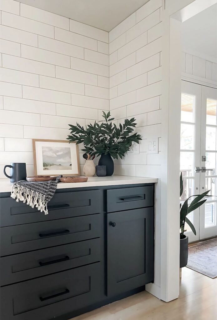 kitchen cabinets painted with iron ore with white countertops and tile
