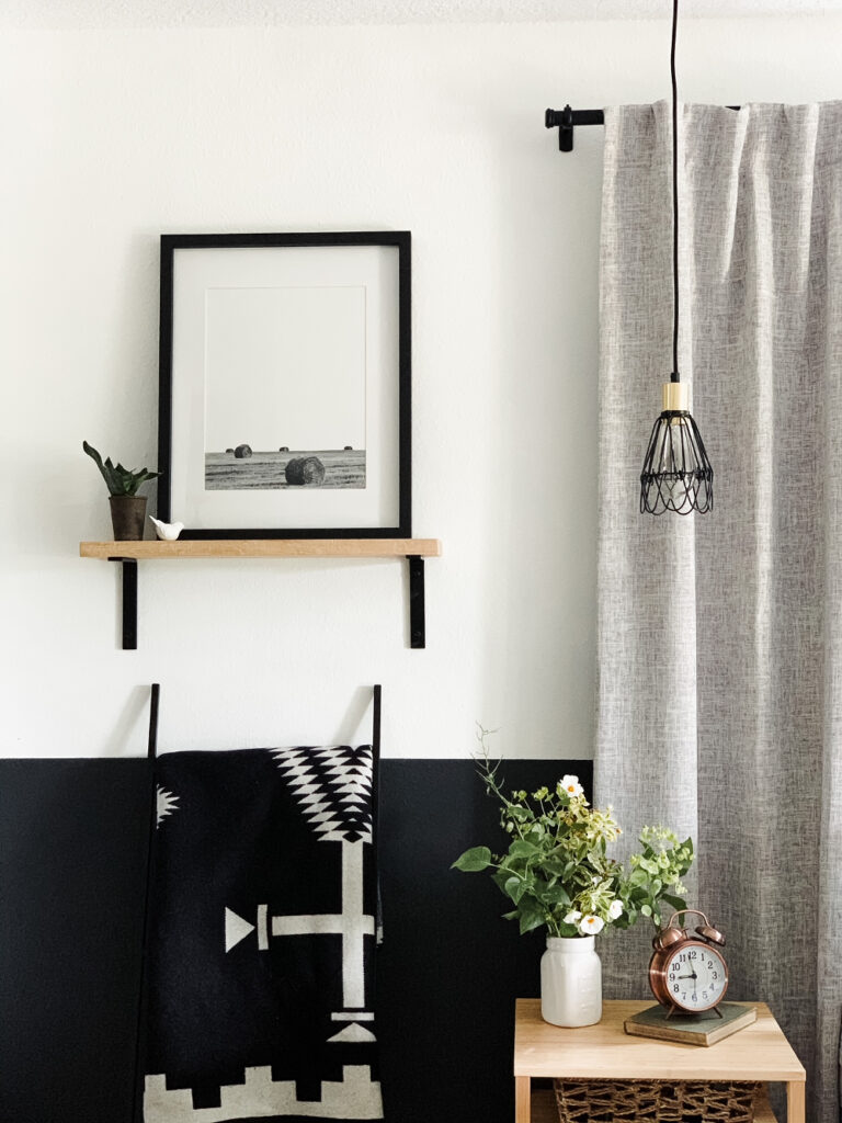 bedroom nightstand with hanging pendant light and shelf