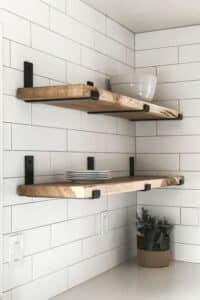 kitchen wood shelves with metal brackets and white backsplash