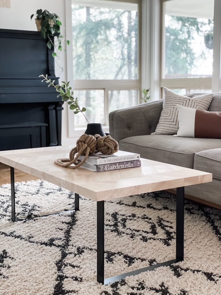 living room coffee table with sofa and rug