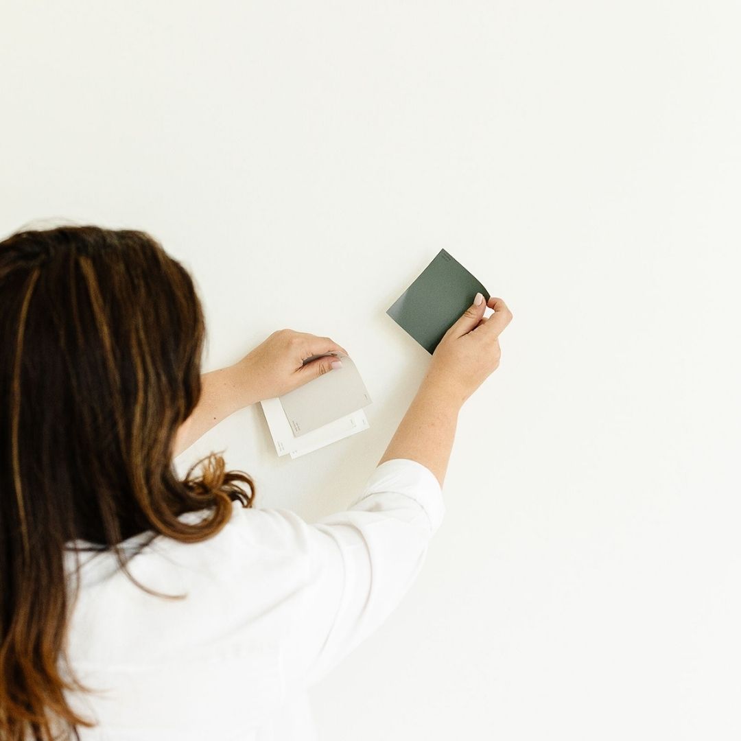 woman choosing wall paint colors