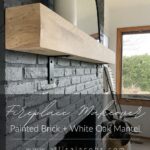 black brick fireplace with text: fireplace makeover