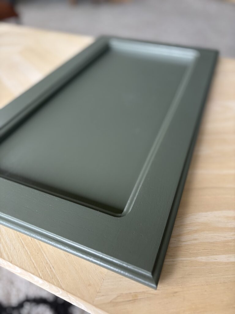 olive green painted bathroom cabinet door